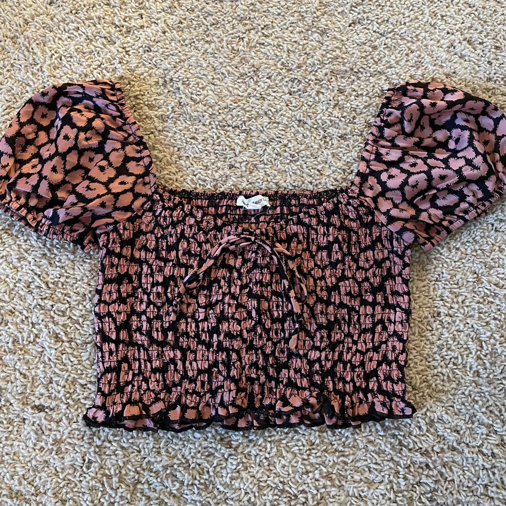 Pink and black crop top with leopard print detail. So fun and versatile!